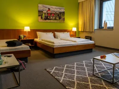 Ein Bett oder Betten in einem Zimmer der Unterkunft k1 sporthotel - Bike & Ski inklusive Hotel