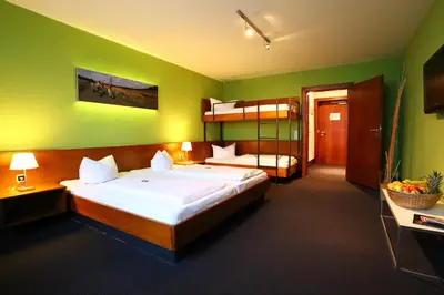 Ein Bett oder Betten in einem Zimmer der Unterkunft k1 sporthotel - Bike & Ski inklusive Hotel