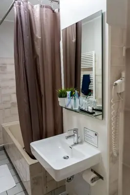 Ein Badezimmer in der Unterkunft k1 sporthotel - Bike & Ski inklusive Hotel