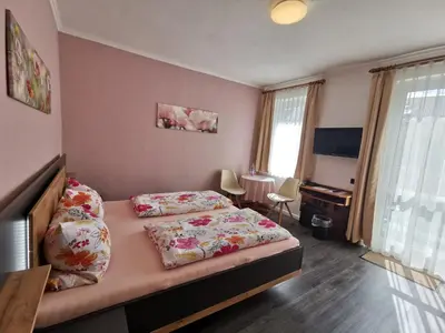 Ein Bett oder Betten in einem Zimmer der Unterkunft Haus am Kurpark Hotel Garni