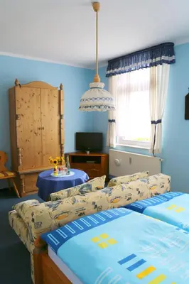 Ein Bett oder Betten in einem Zimmer der Unterkunft Gaststätte & Pension Waldquell