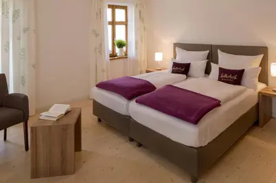 Ein Bett oder Betten in einem Zimmer der Unterkunft Hollerhöfe - Zu Gast im Dorf Betriebsgesellschaft mbH