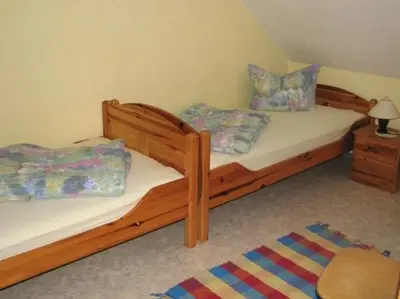 Ein Bett oder Betten in einem Zimmer der Unterkunft Kösseineblick