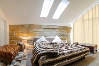 Ein Bett oder Betten in einem Zimmer der Unterkunft Villa Johner
