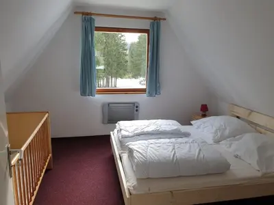 Ein Bett oder Betten in einem Zimmer der Unterkunft Erzgebirgsidyll