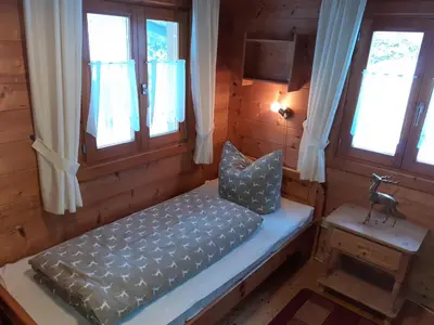 Ein Bett oder Betten in einem Zimmer der Unterkunft Blockhäuser Stamsried