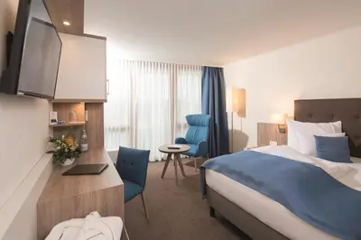 Ein Bett oder Betten in einem Zimmer der Unterkunft Siebenquell® GesundZeitResort