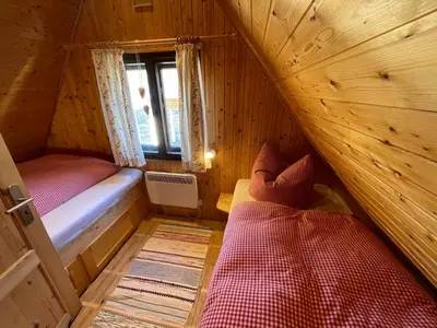 Ein Bett oder Betten in einem Zimmer der Unterkunft Berghütte Fichtelstreich