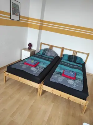 Ein Bett oder Betten in einem Zimmer der Unterkunft Ferienwohnungen Plauen