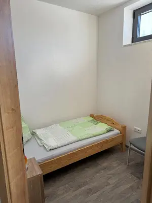 Ein Bett oder Betten in einem Zimmer der Unterkunft Ferienwohnung Zeitler