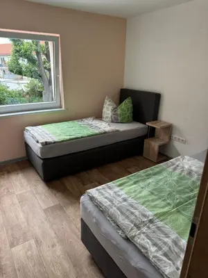Ein Bett oder Betten in einem Zimmer der Unterkunft Ferienwohnung Zeitler