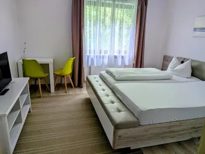 Ein Bett oder Betten in einem Zimmer der Unterkunft Pension Hofer