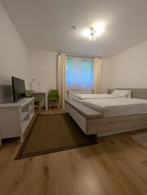 Ein Bett oder Betten in einem Zimmer der Unterkunft Pension Hofer