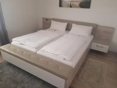 Ein Bett oder Betten in einem Zimmer der Unterkunft Pension Hofer