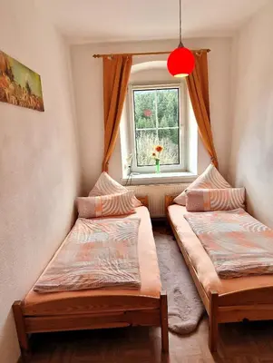 Ein Bett oder Betten in einem Zimmer der Unterkunft Ferienwohnungen 