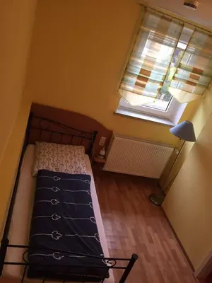 Ein Bett oder Betten in einem Zimmer der Unterkunft Hotel Konditorei Cafe Dora