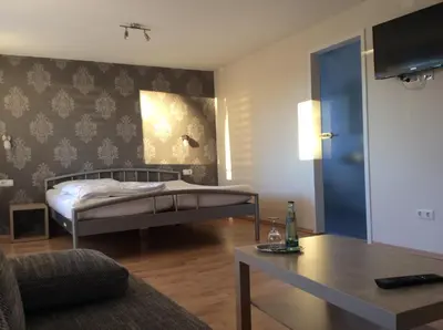 Ein Bett oder Betten in einem Zimmer der Unterkunft Hotel Konditorei Cafe Dora