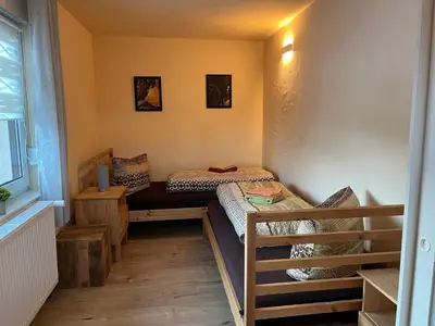 Ein Bett oder Betten in einem Zimmer der Unterkunft Ferienhaus Fichtelberg