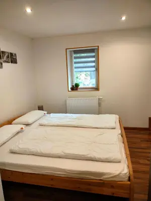 Ein Bett oder Betten in einem Zimmer der Unterkunft Ferienhaus Kaufmanns Cafe