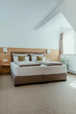 Ein Bett oder Betten in einem Zimmer der Unterkunft Kondrauer Hof