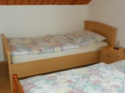 Ein Bett oder Betten in einem Zimmer der Unterkunft Ferienwohnung am Weissenstädter See