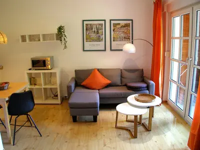 Ein Sitzbereich in der Unterkunft Park-Villa, Therme und Kurpark