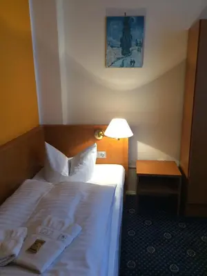 Ein Bett oder Betten in einem Zimmer der Unterkunft Hotel Central
