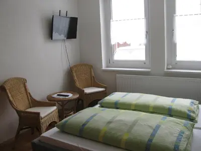 Ein Bett oder Betten in einem Zimmer der Unterkunft Reiterhof & Pension Lienemann