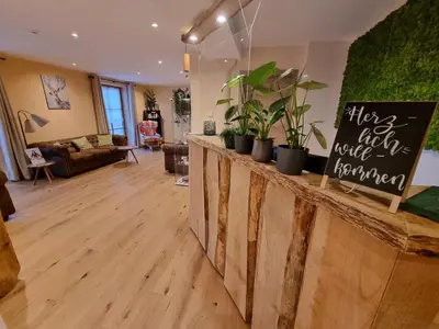 Ein Sitzbereich in der Unterkunft Landhotel Großeiberhof