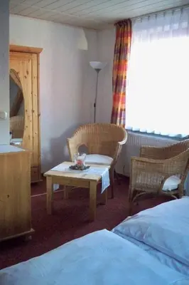 Ein Bett oder Betten in einem Zimmer der Unterkunft Gasthof zum Döhlerwald