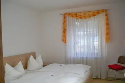 Ein Bett oder Betten in einem Zimmer der Unterkunft Gasthof zum Döhlerwald