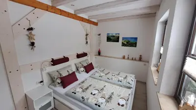 Ein Bett oder Betten in einem Zimmer der Unterkunft Ferienwohnung Aronia Garten