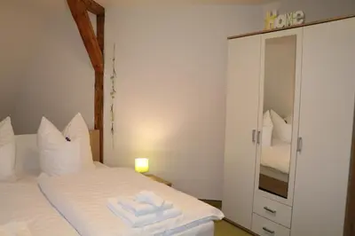 Ein Bett oder Betten in einem Zimmer der Unterkunft Fewo Friedrichsruh