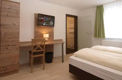 Ein Bett oder Betten in einem Zimmer der Unterkunft Schlabecks 'Fränkischer Hof' -- Pegnitz-Garni-Hotel