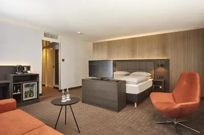 Ein Bett oder Betten in einem Zimmer der Unterkunft H4 Hotel Residenzschloss Bayreuth