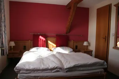 Ein Bett oder Betten in einem Zimmer der Unterkunft Steiner Wirt