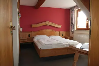 Ein Bett oder Betten in einem Zimmer der Unterkunft Steiner Wirt