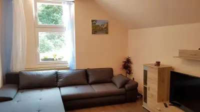 Ein Sitzbereich in der Unterkunft Pension-Puttlachtal