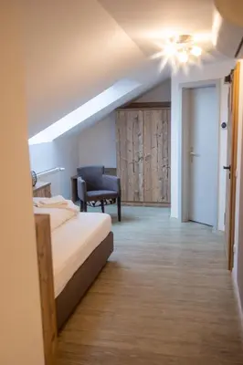 Ein Bett oder Betten in einem Zimmer der Unterkunft Landgasthof Am Sonnenhang