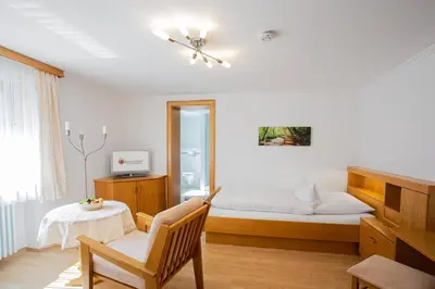 Ein Bett oder Betten in einem Zimmer der Unterkunft Gästehaus Prinzregent Luitpold