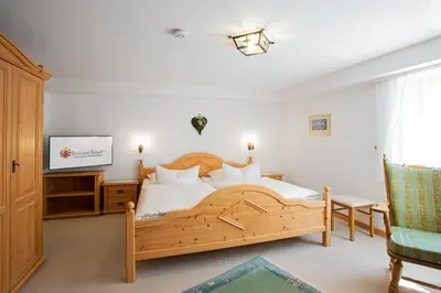Ein Bett oder Betten in einem Zimmer der Unterkunft Gästehaus Prinzregent Luitpold