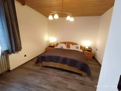 Ein Bett oder Betten in einem Zimmer der Unterkunft Pension Erika