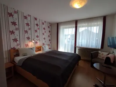 Ein Bett oder Betten in einem Zimmer der Unterkunft Pension Erika