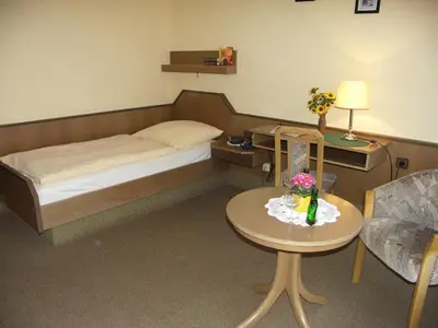 Ein Bett oder Betten in einem Zimmer der Unterkunft Pension Wölfel