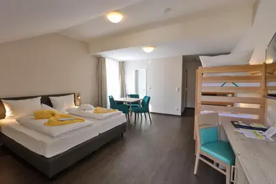 Ein Bett oder Betten in einem Zimmer der Unterkunft Sonnenhotel Bayerischer Hof - All Inklusive