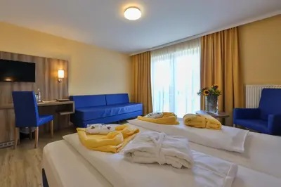Ein Bett oder Betten in einem Zimmer der Unterkunft Sonnenhotel Bayerischer Hof - All Inklusive