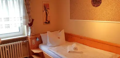 Ein Bett oder Betten in einem Zimmer der Unterkunft Villa Helvetia