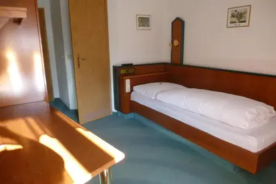 Ein Bett oder Betten in einem Zimmer der Unterkunft Blaue Traube