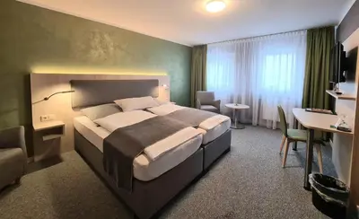 Ein Bett oder Betten in einem Zimmer der Unterkunft Verwöhn-Pension Wiesengrund