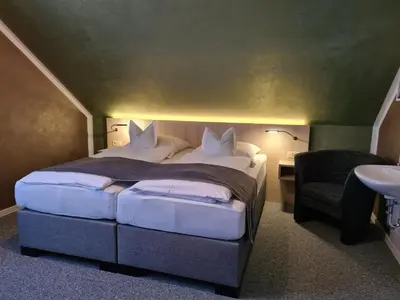 Ein Bett oder Betten in einem Zimmer der Unterkunft Verwöhn-Pension Wiesengrund